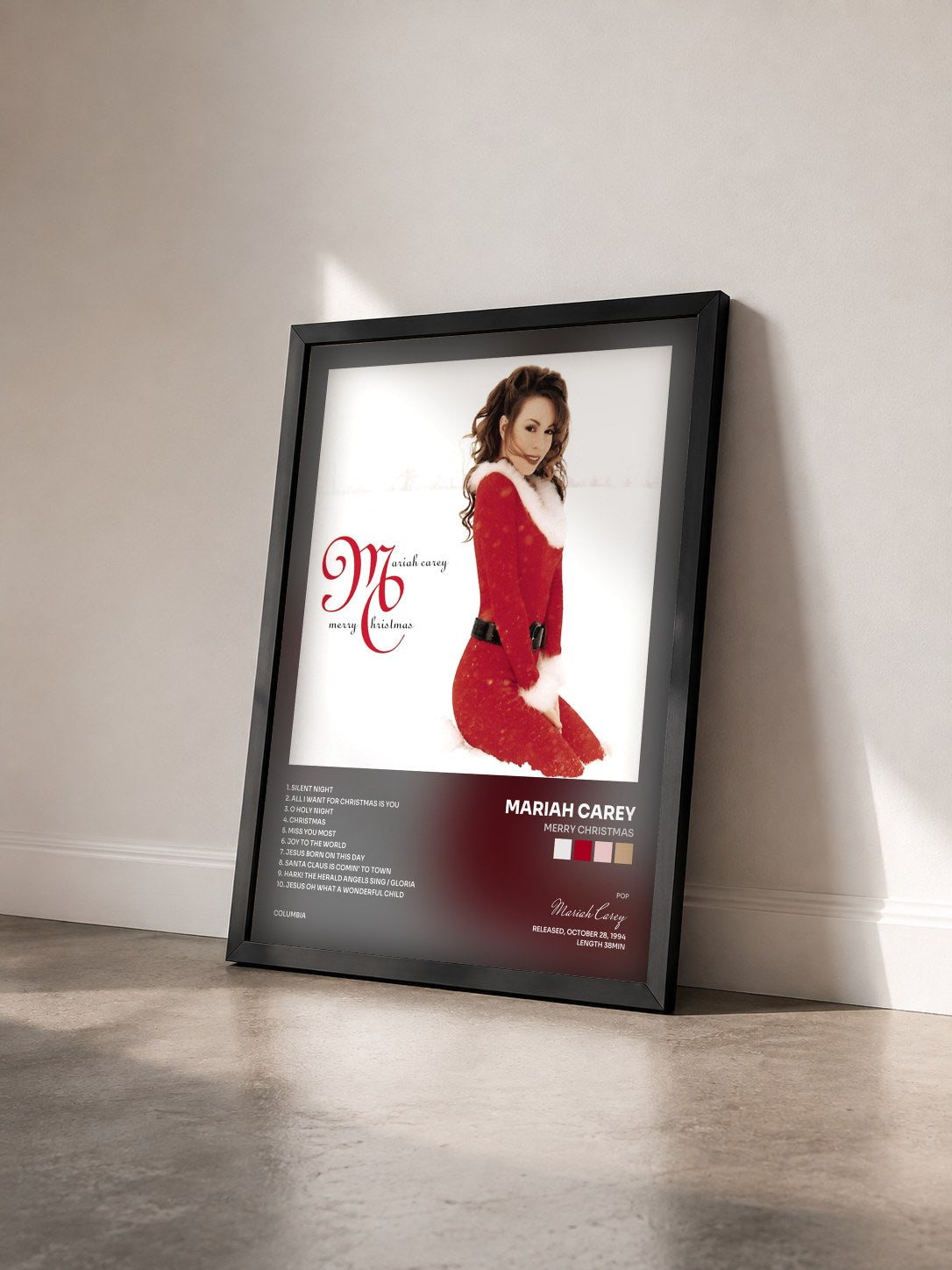 #noir Tableau de l'album Merry Christmas de Mariah Carey vu de trois quarts, cadre noir