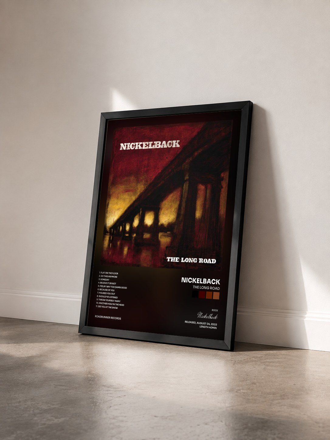#noir Tableau de l'album The Long Road de Nickelback vu de trois quarts, cadre noir
