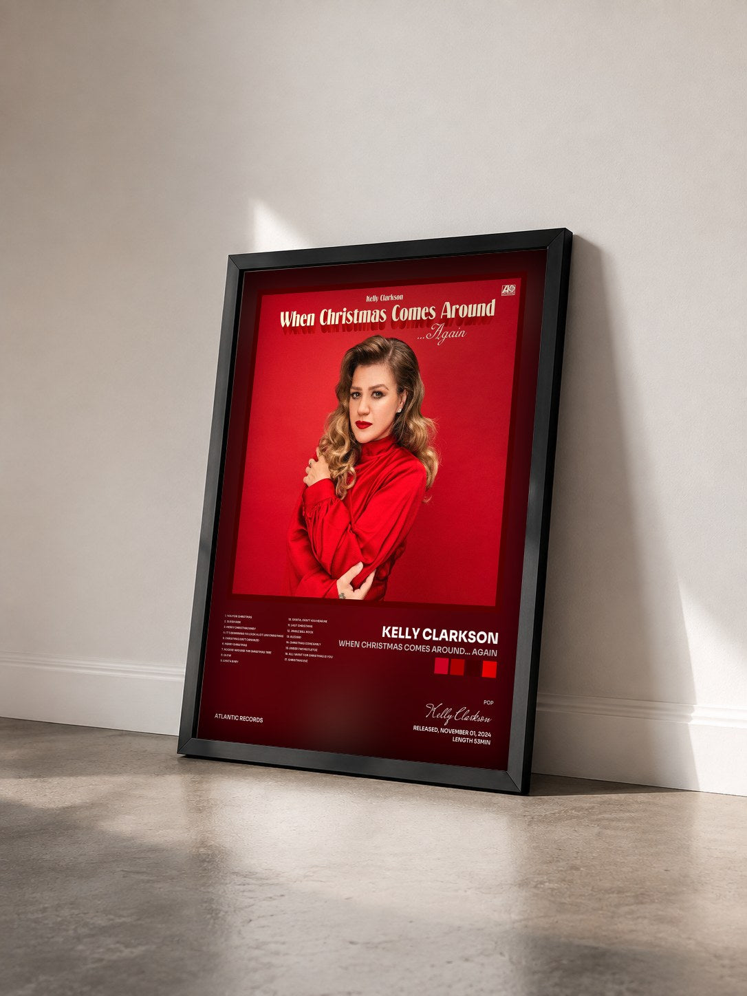 #noir Tableau de l'album When Christmas Comes Around… Again de Kelly Clarkson vu de trois quarts, cadre noir