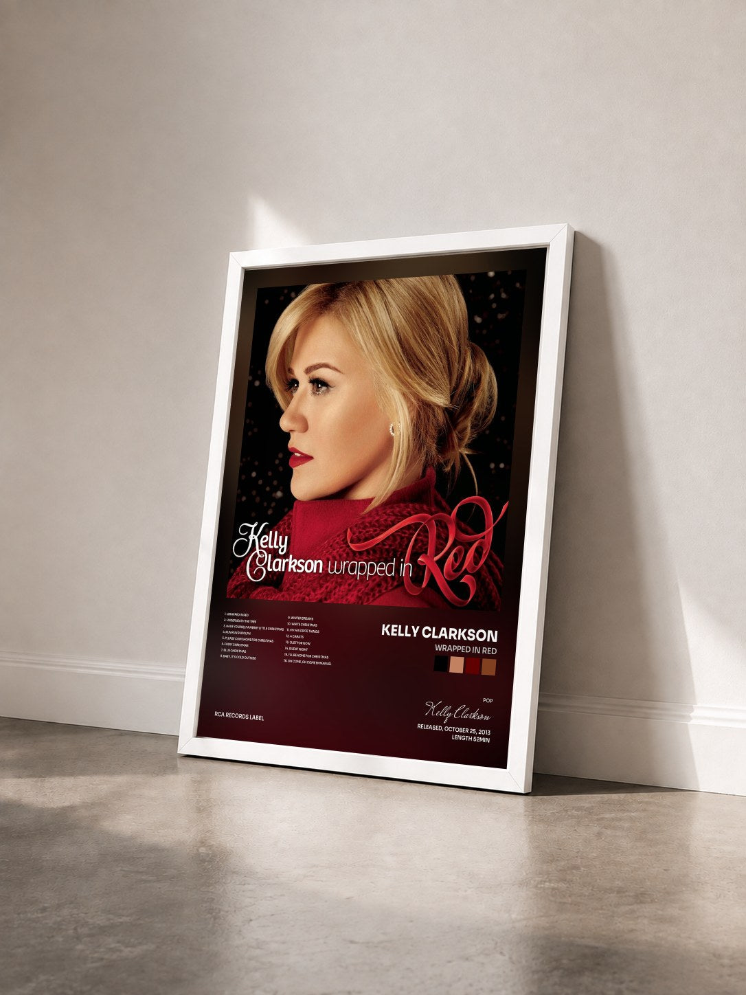 #blanc Tableau de l'album Wrapped In Red de Kelly Clarkson vu de trois quarts, cadre blanc
