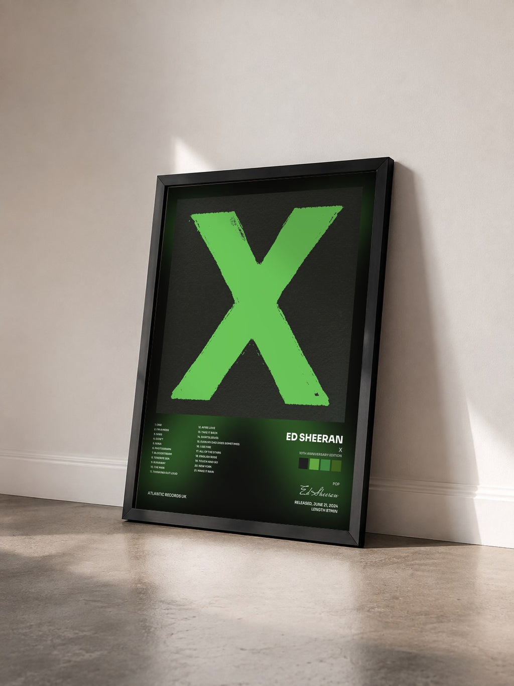 #noir x (10th Anniversary Edition) by Ed Sheeran as a framed art print seen at an angle, black frame