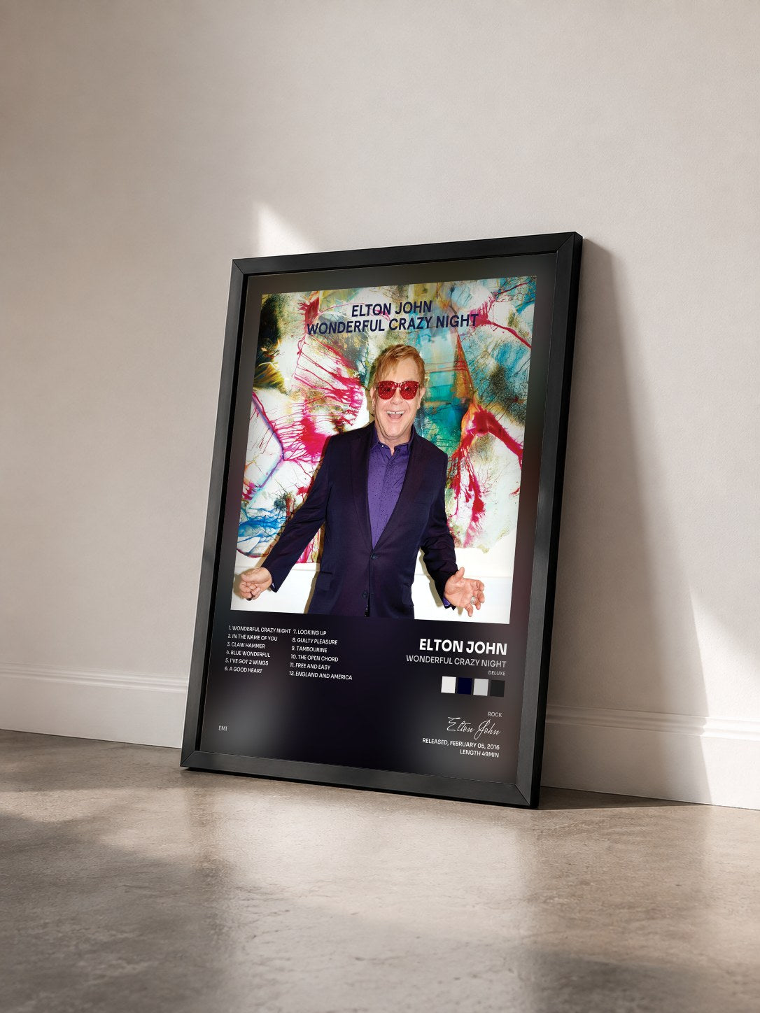 #noir Tableau de l'album Wonderful Crazy Night (Deluxe) de Elton John vu de trois quarts, cadre noir