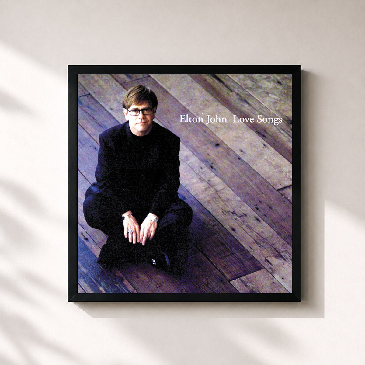 #noir Tableau carré de l'album Love Songs de Elton John, cadre noir 32x32 cm