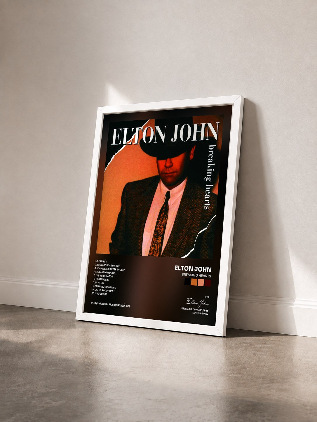 #blanc Tableau de l'album Breaking Hearts de Elton John vu de trois quarts, cadre blanc