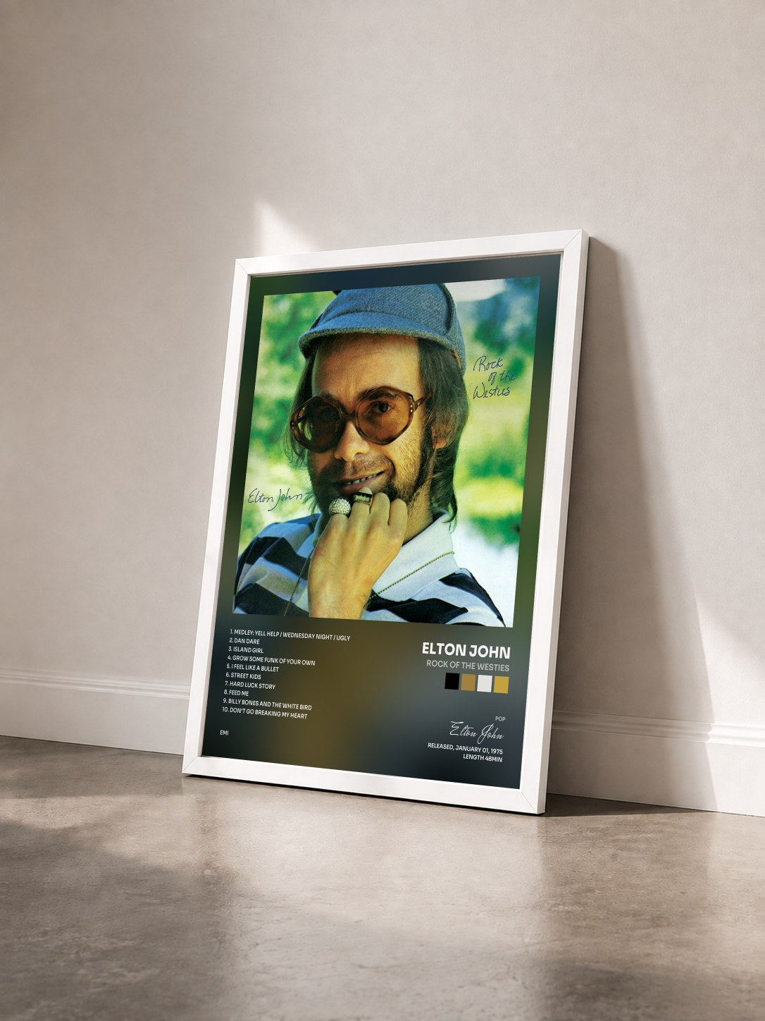 #blanc Tableau de l'album Rock Of The Westies de Elton John vu de trois quarts, cadre blanc