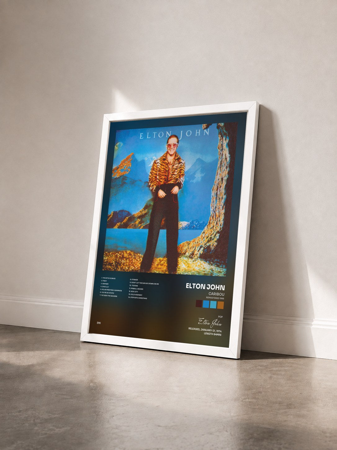 #blanc Tableau de l'album Caribou (Remastered 1995) de Elton John vu de trois quarts, cadre blanc
