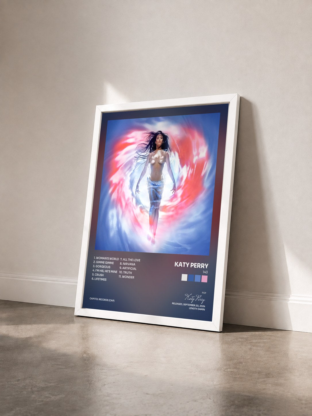 #blanc Tableau de l'album 143 de Katy Perry vu de trois quarts, cadre blanc
