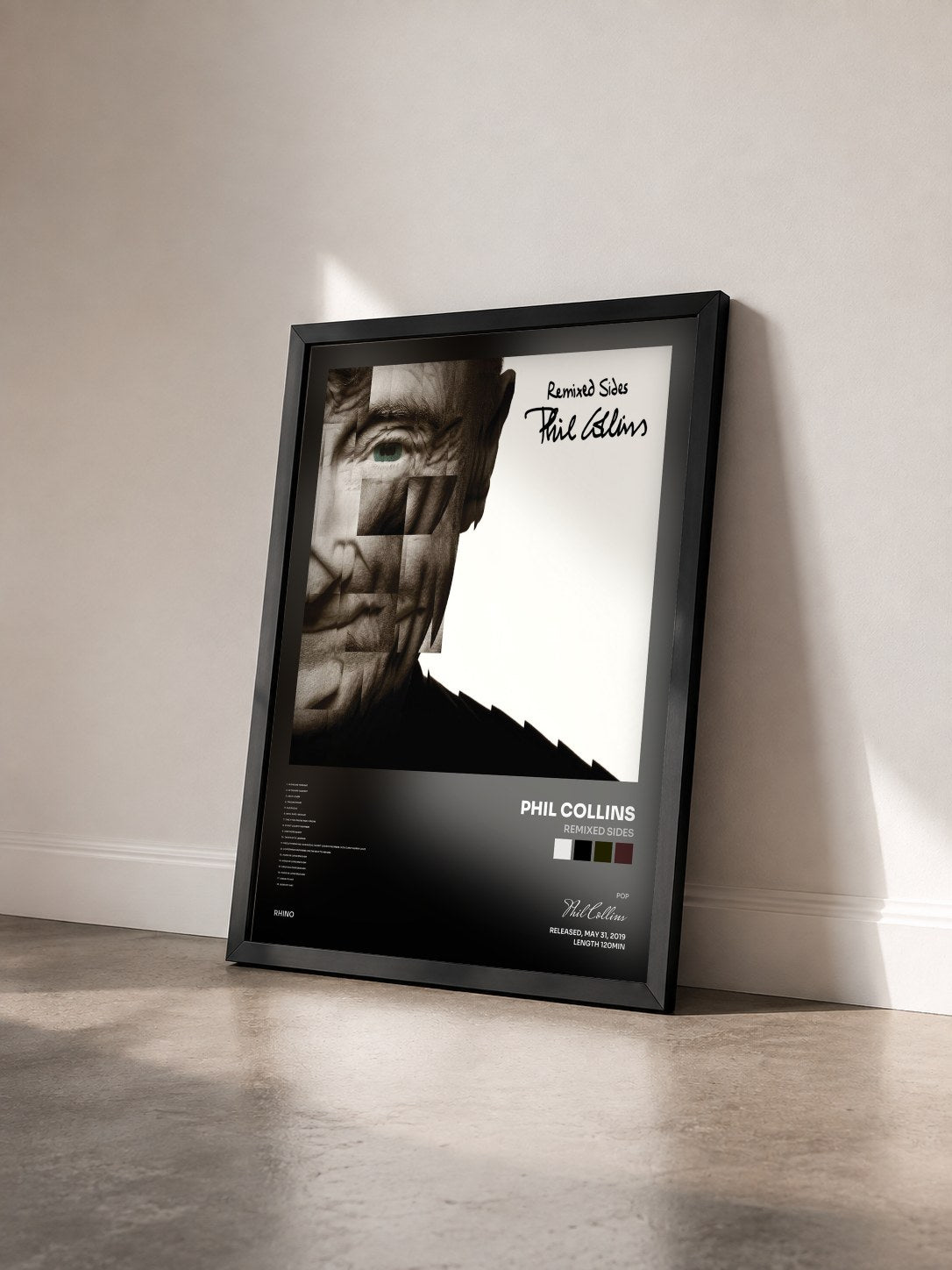 #noir Tableau de l'album Remixed Sides de Phil Collins vu de trois quarts, cadre noir