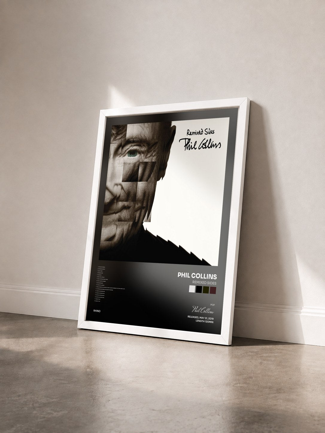 #blanc Tableau de l'album Remixed Sides de Phil Collins vu de trois quarts, cadre blanc