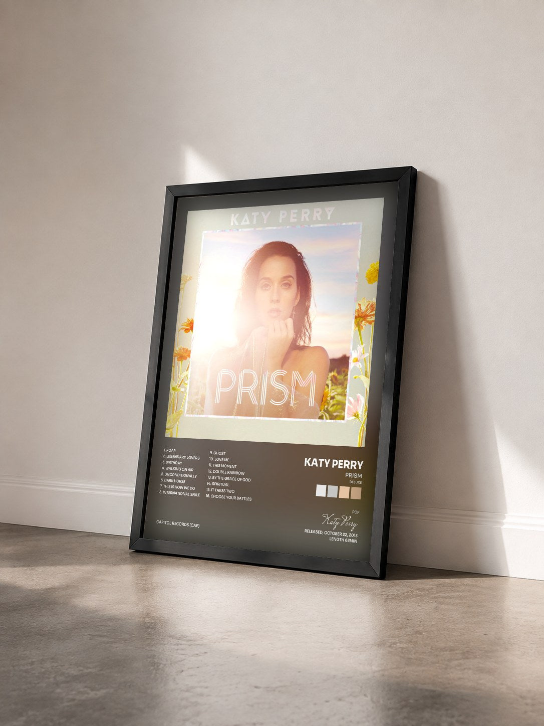 #noir Tableau de l'album PRISM (Deluxe) de Katy Perry vu de trois quarts, cadre noir
