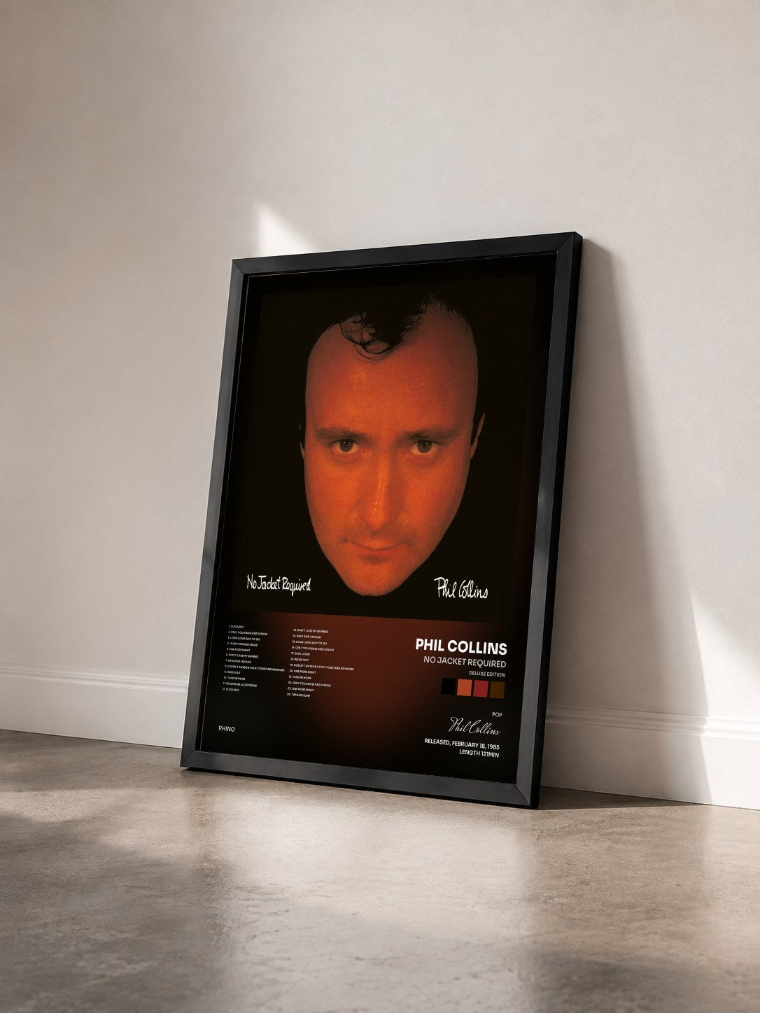 #noir Tableau de l'album No Jacket Required (Deluxe Edition) de Phil Collins vu de trois quarts, cadre noir