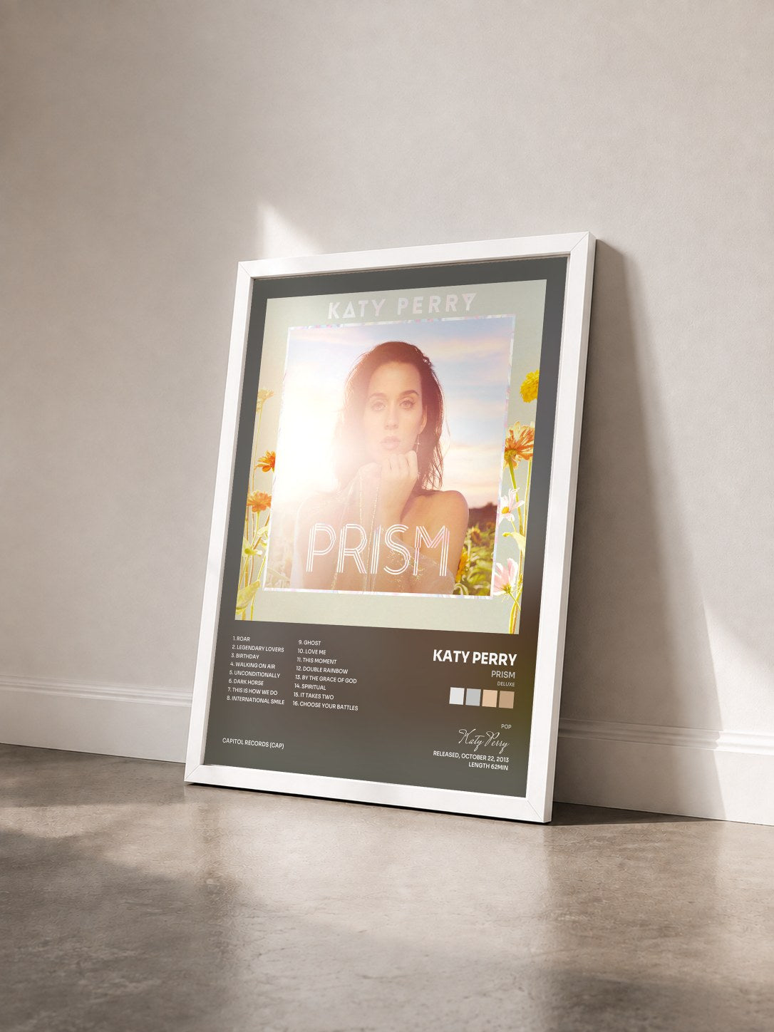 #blanc Tableau de l'album PRISM (Deluxe) de Katy Perry vu de trois quarts, cadre blanc