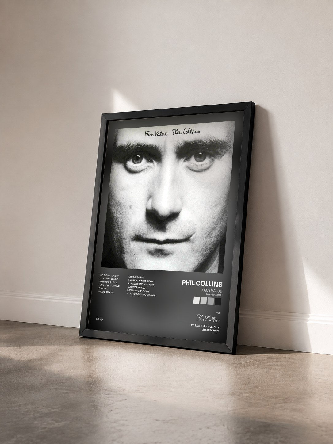 #noir Tableau de l'album Face Value (2016 Remaster) de Phil Collins vu de trois quarts, cadre noir