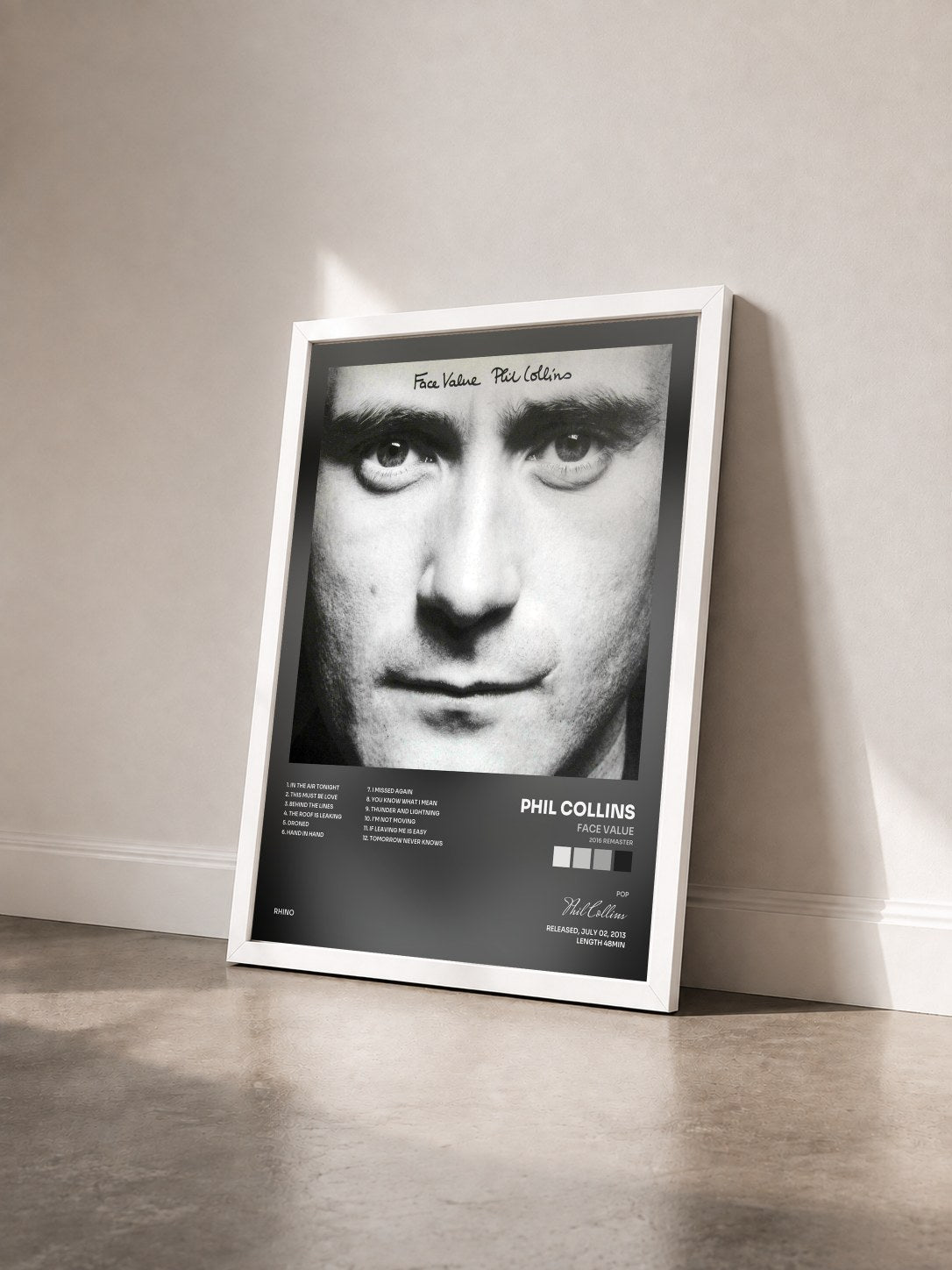 #blanc Tableau de l'album Face Value (2016 Remaster) de Phil Collins vu de trois quarts, cadre blanc