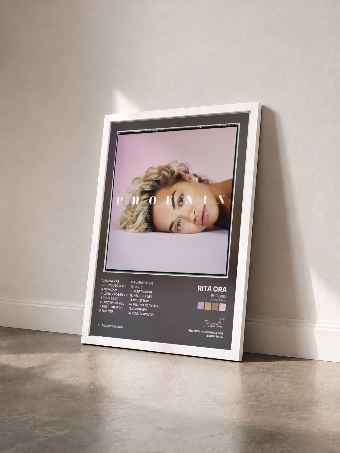 #blanc Phoenix (Deluxe Edition) by Rita Ora as a framed art print seen at an angle, white frame