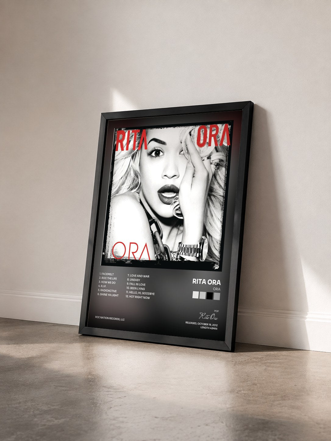 #noir ORA by Rita Ora as a framed art print seen at an angle, black frame