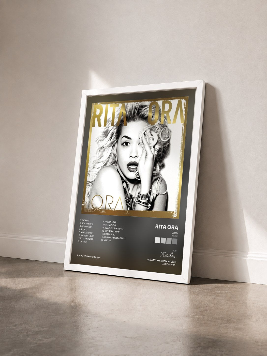 #blanc ORA (Deluxe) by Rita Ora as a framed art print seen at an angle, white frame