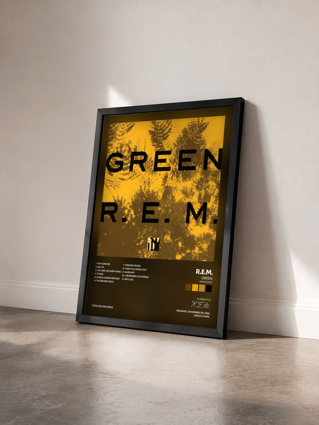 #noir Green (Remastered) by R.E.M. as a framed art print seen at an angle, black frame