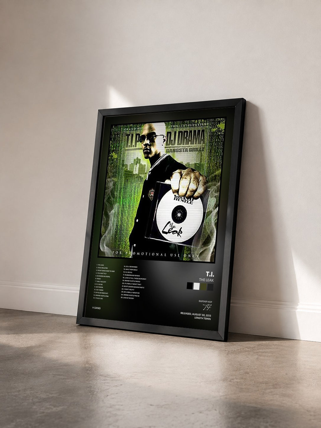 #noir The Leak by T.I. as a framed art print seen at an angle, black frame