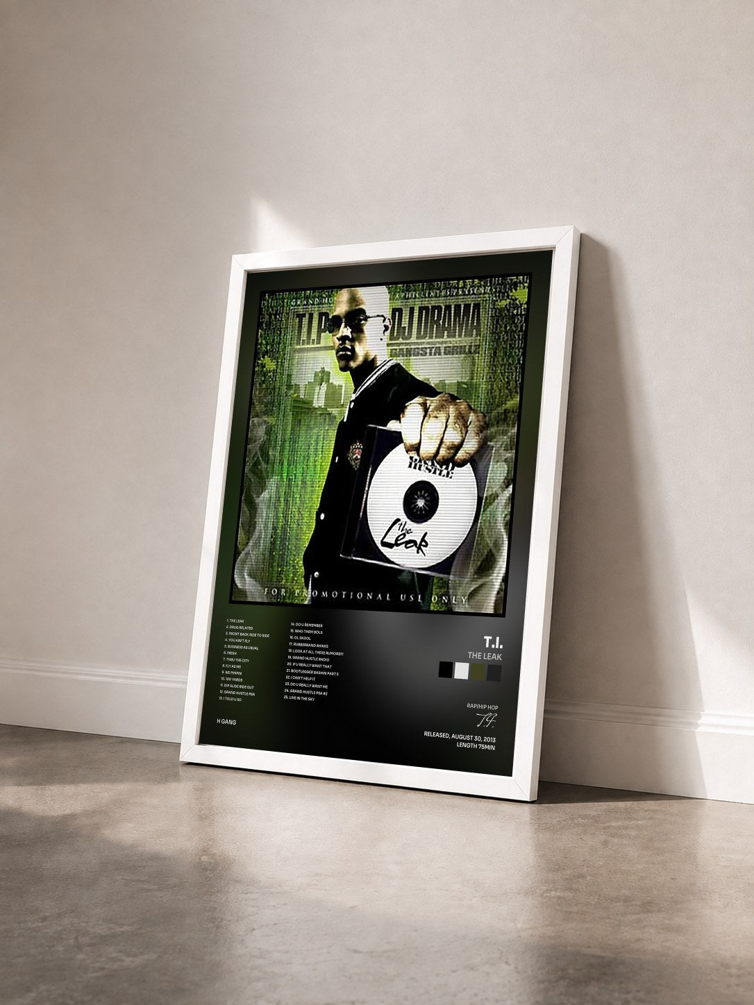 #blanc The Leak by T.I. as a framed art print seen at an angle, white frame