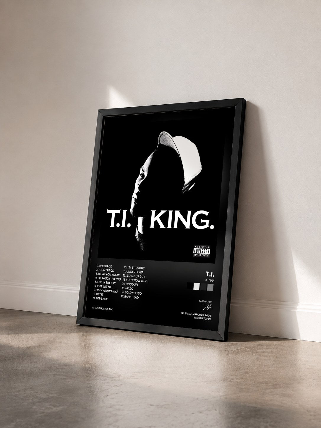 #noir King by T.I. as a framed art print seen at an angle, black frame