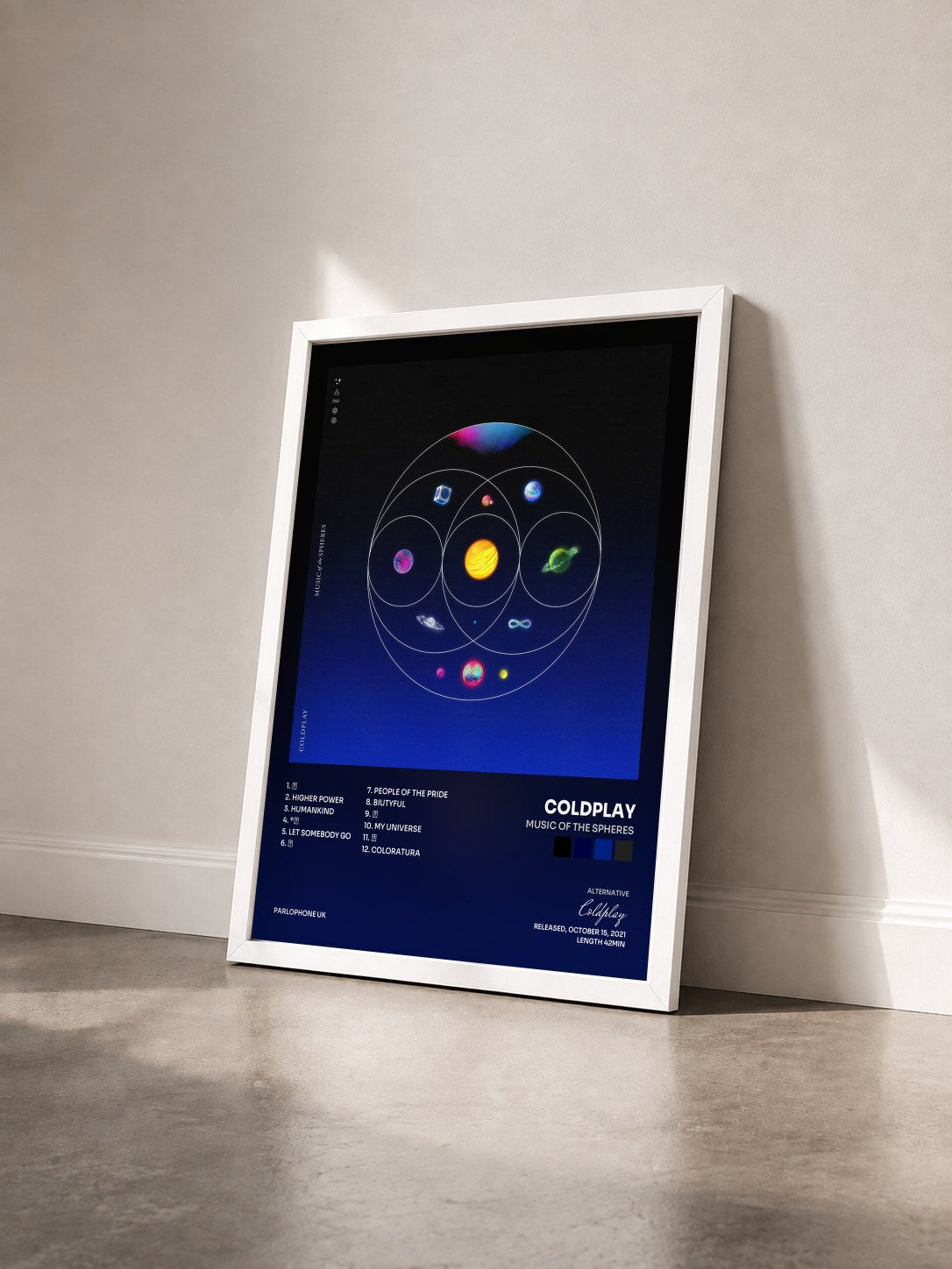 #blanc Music Of The Spheres by Coldplay as a framed art print seen at an angle, white frame