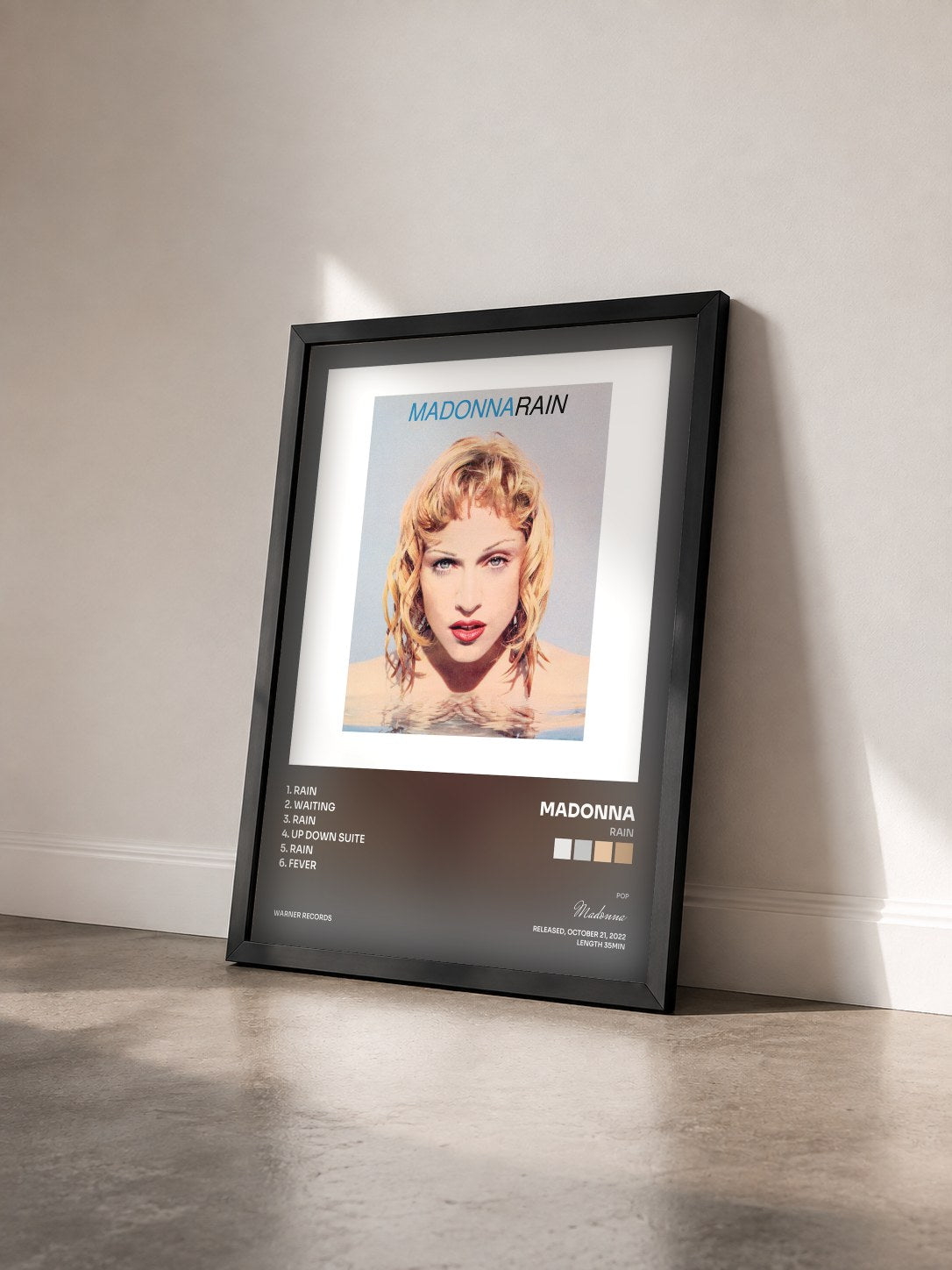 #noir Tableau de l'album Rain de Madonna vu de trois quarts, cadre noir