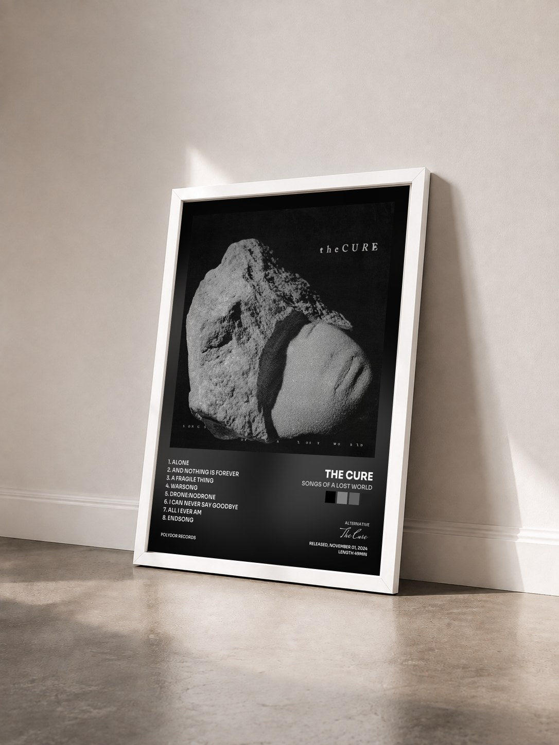 #blanc Tableau de l'album Songs Of A Lost World de The Cure vu de trois quarts, cadre blanc