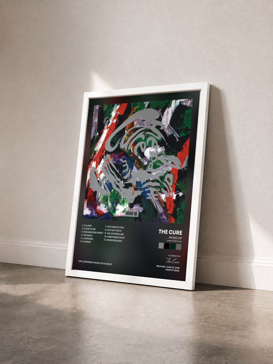 #blanc Tableau de l'album Mixed Up (Remastered 2018) de The Cure vu de trois quarts, cadre blanc