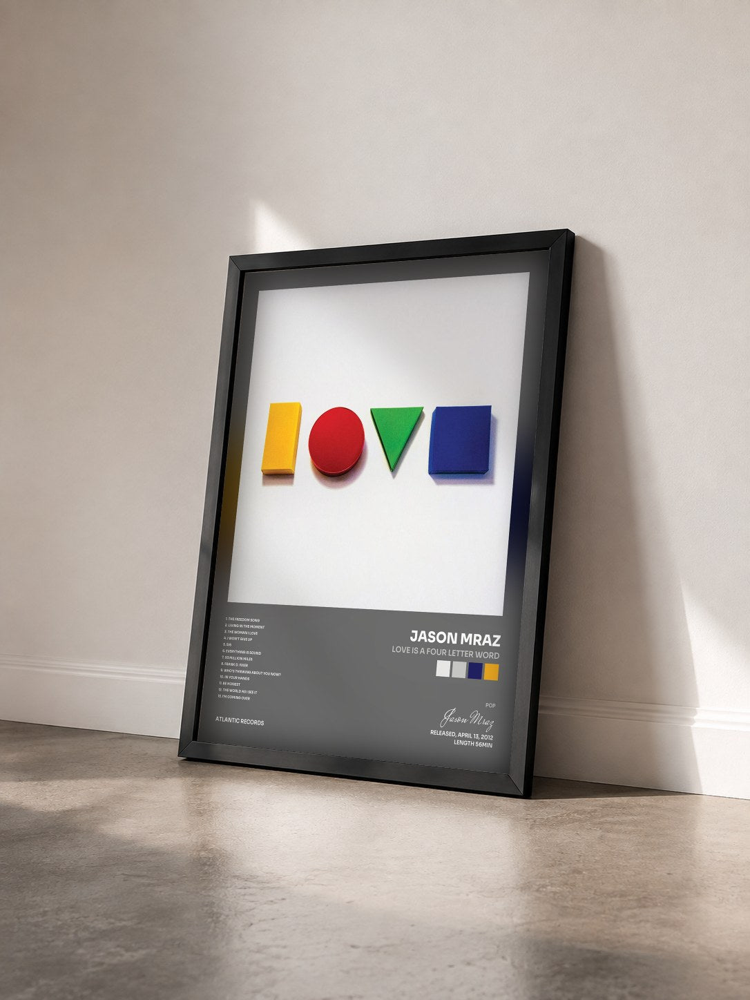 #noir Tableau de l'album Love Is a Four Letter Word de Jason Mraz vu de trois quarts, cadre noir