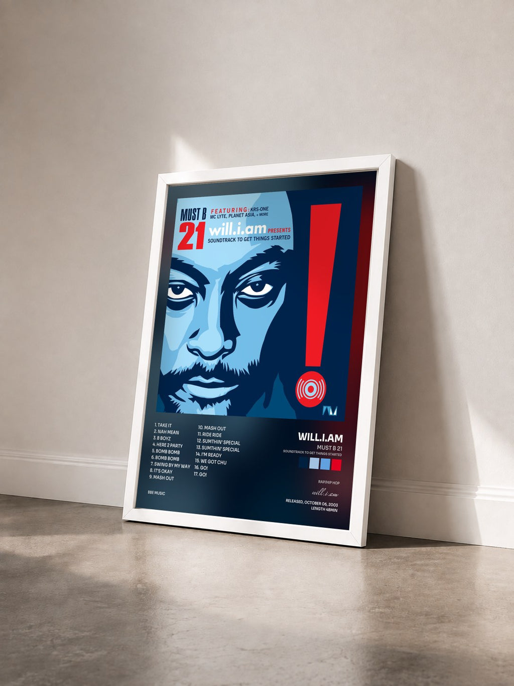 #blanc Tableau de l'album Must B 21 (Soundtrack to Get Things Started) de will.i.am vu de trois quarts, cadre blanc