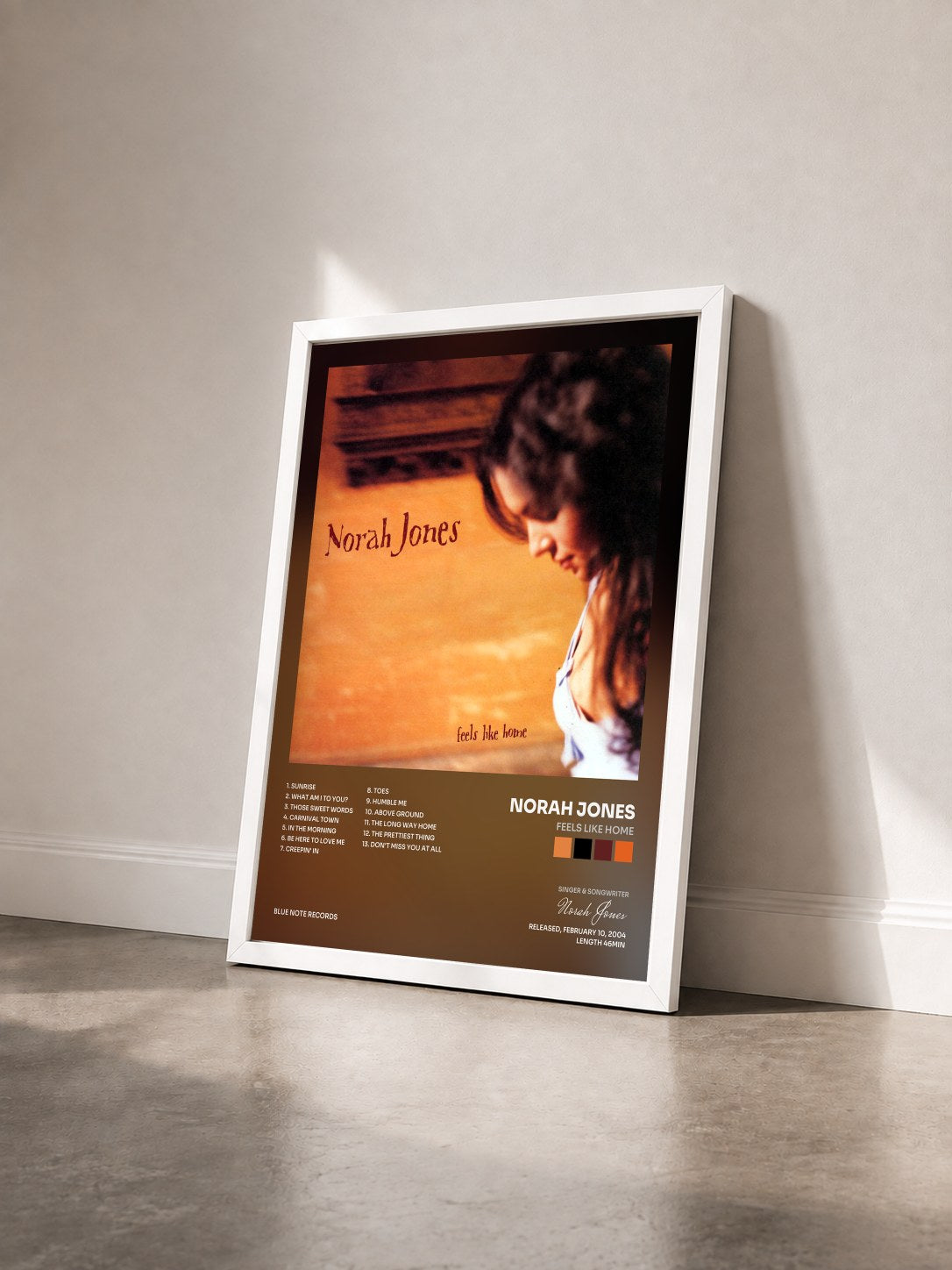 #blanc Feels Like Home by Norah Jones as a framed art print seen at an angle, white frame