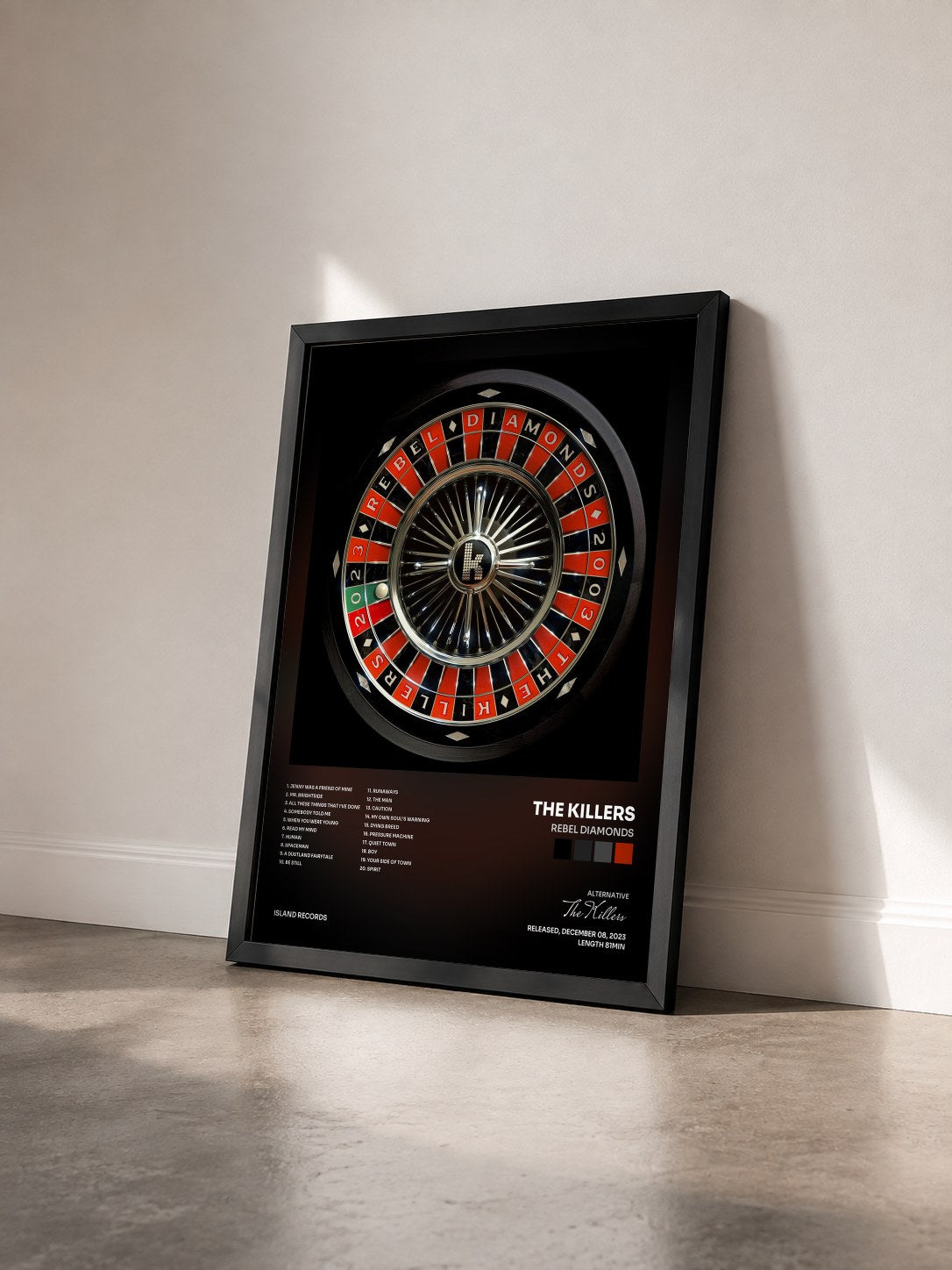 #noir Tableau de l'album Rebel Diamonds de The Killers vu de trois quarts, cadre noir