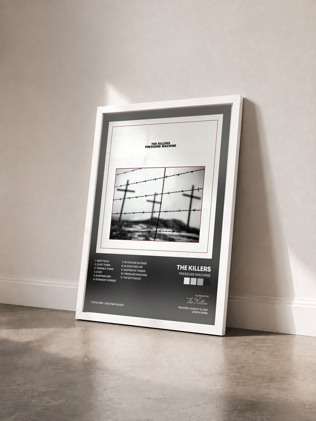 #blanc Tableau de l'album Pressure Machine de The Killers vu de trois quarts, cadre blanc