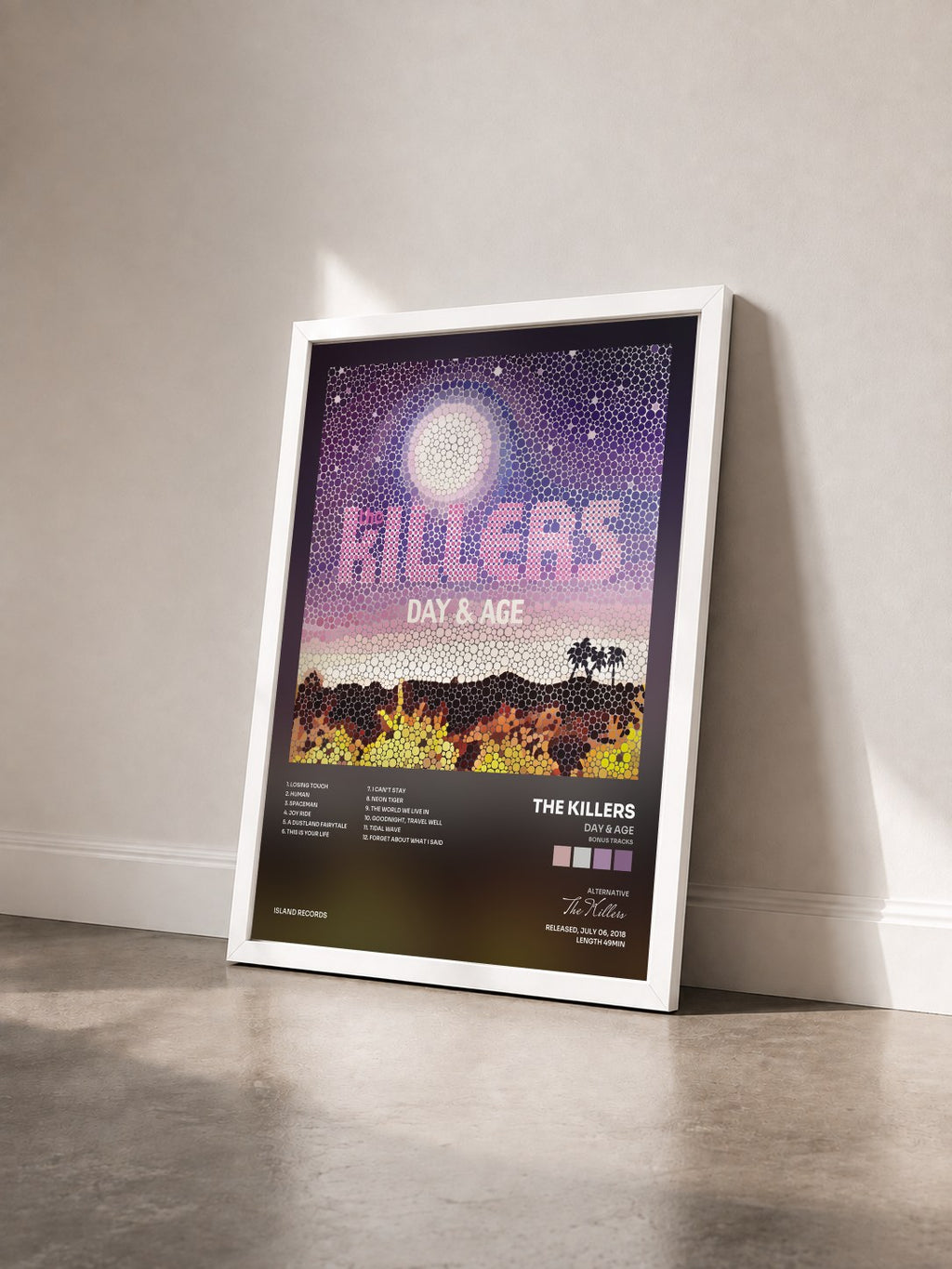 #blanc Tableau de l'album Day & Age (Bonus Tracks) de The Killers vu de trois quarts, cadre blanc