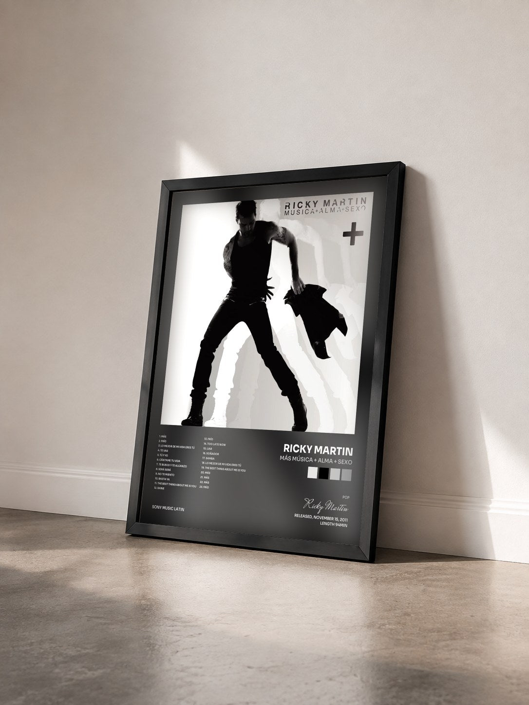 #noir Más Música + Alma + Sexo by Ricky Martin as a framed art print seen at an angle, black frame