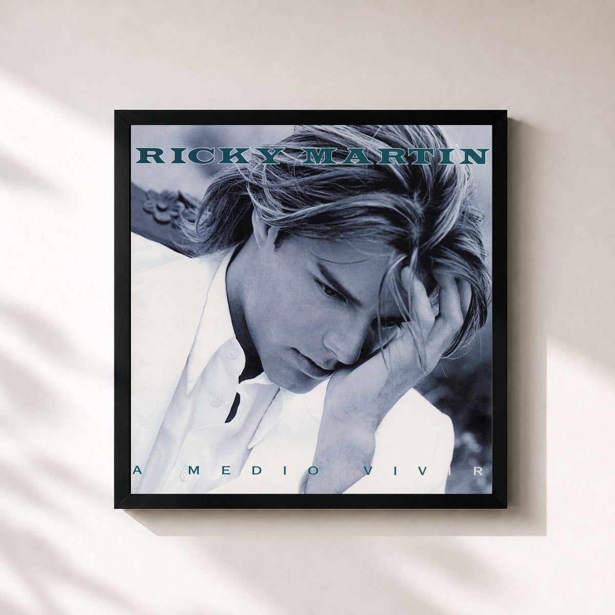 #noir A Medio Vivir by Ricky Martin as a square framed art print, black 32x32 cm frame