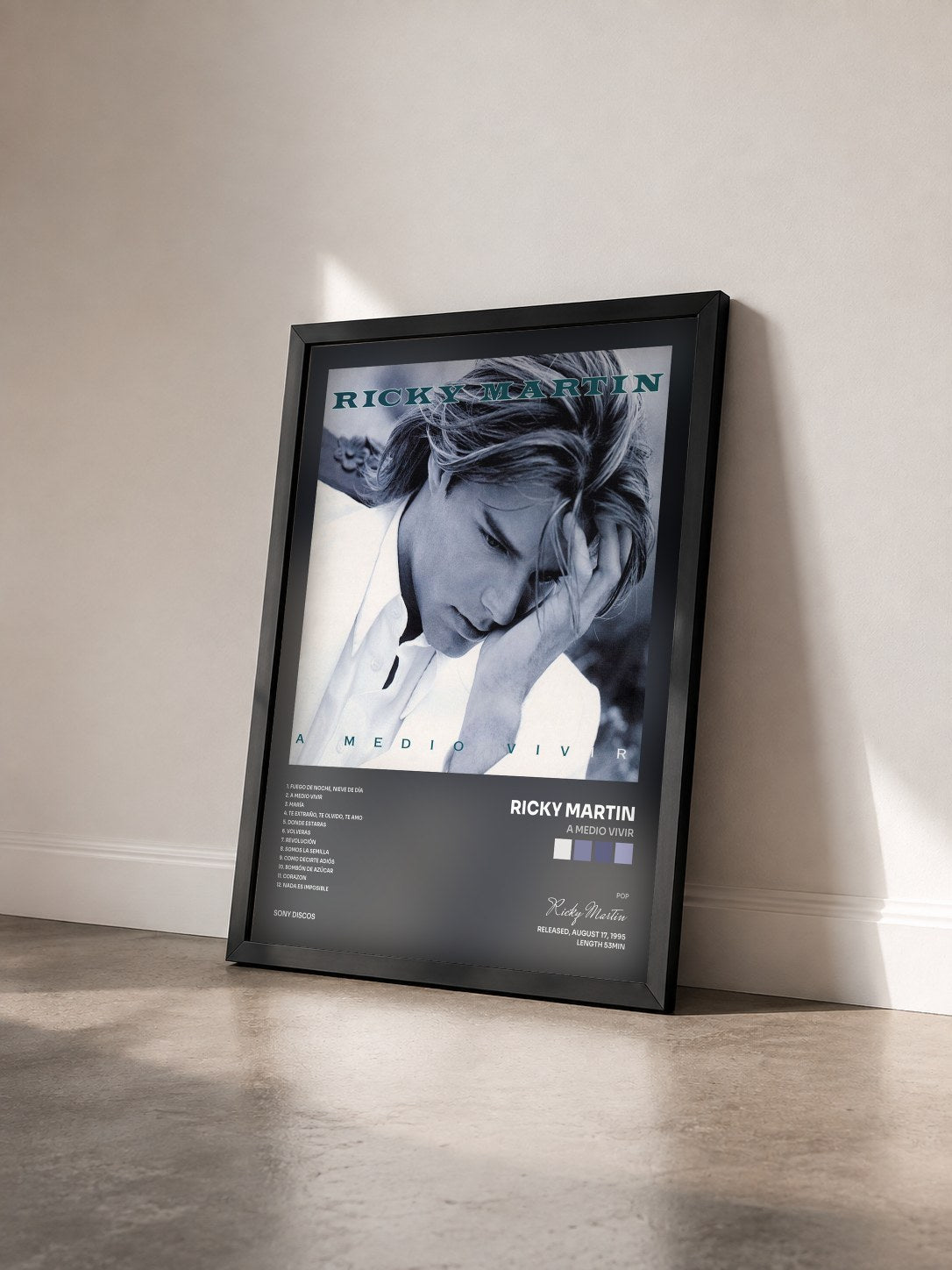 #noir A Medio Vivir by Ricky Martin as a framed art print seen at an angle, black frame
