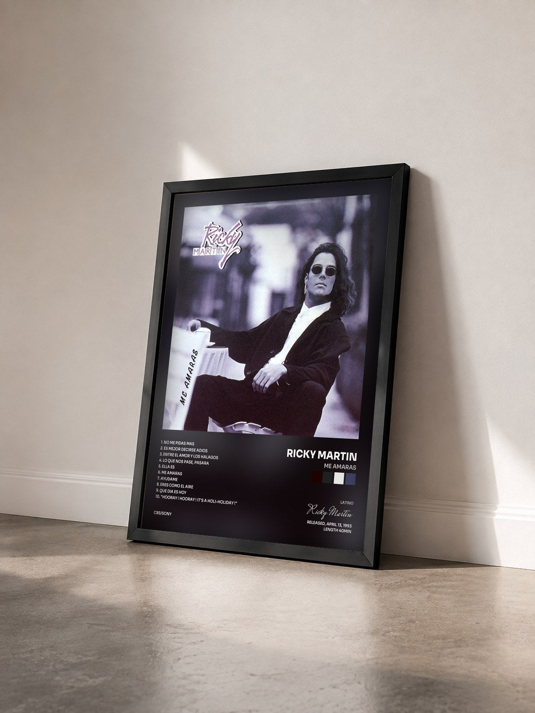 #noir Me Amaras by Ricky Martin as a framed art print seen at an angle, black frame
