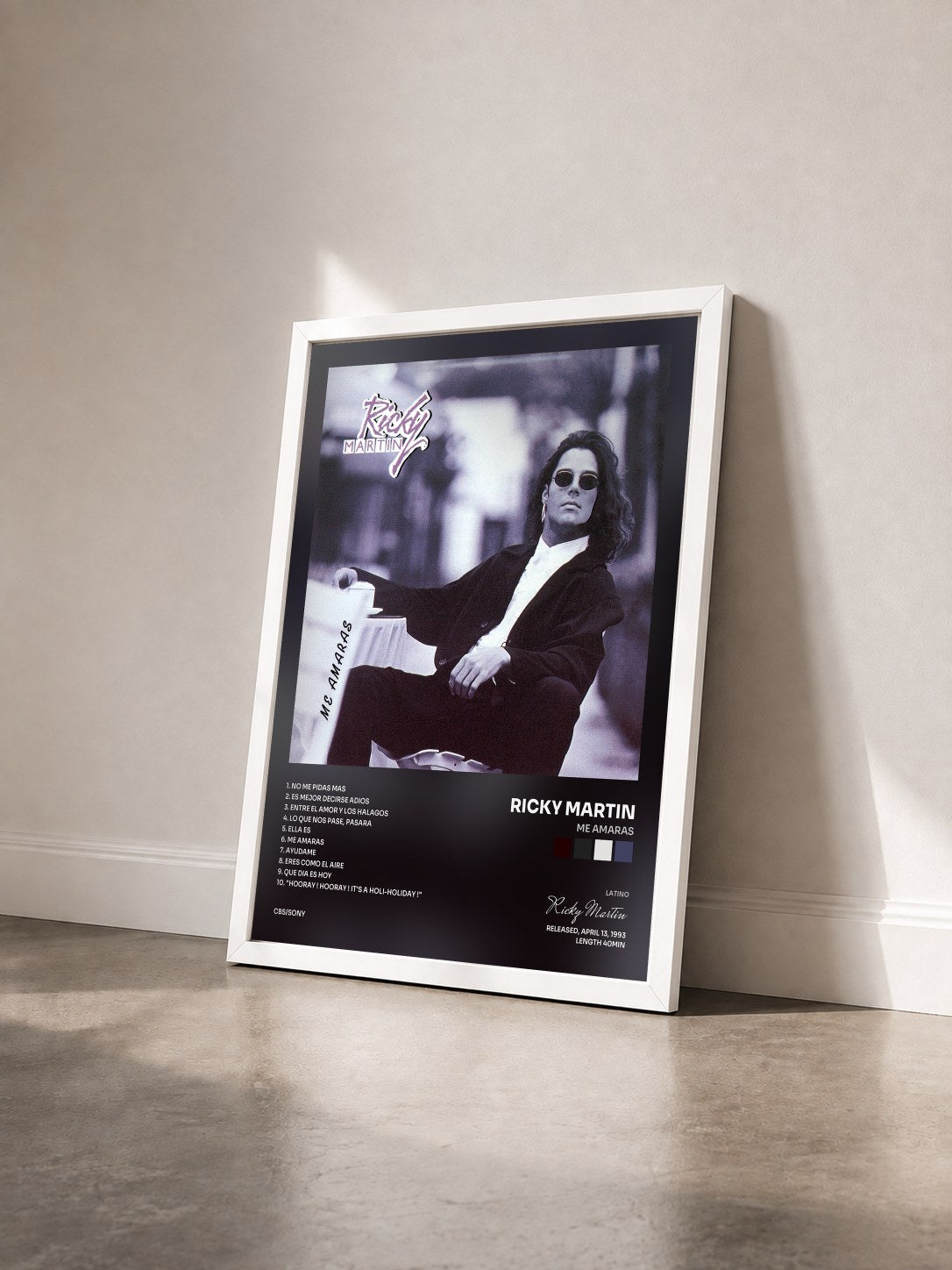 #blanc Me Amaras by Ricky Martin as a framed art print seen at an angle, white frame