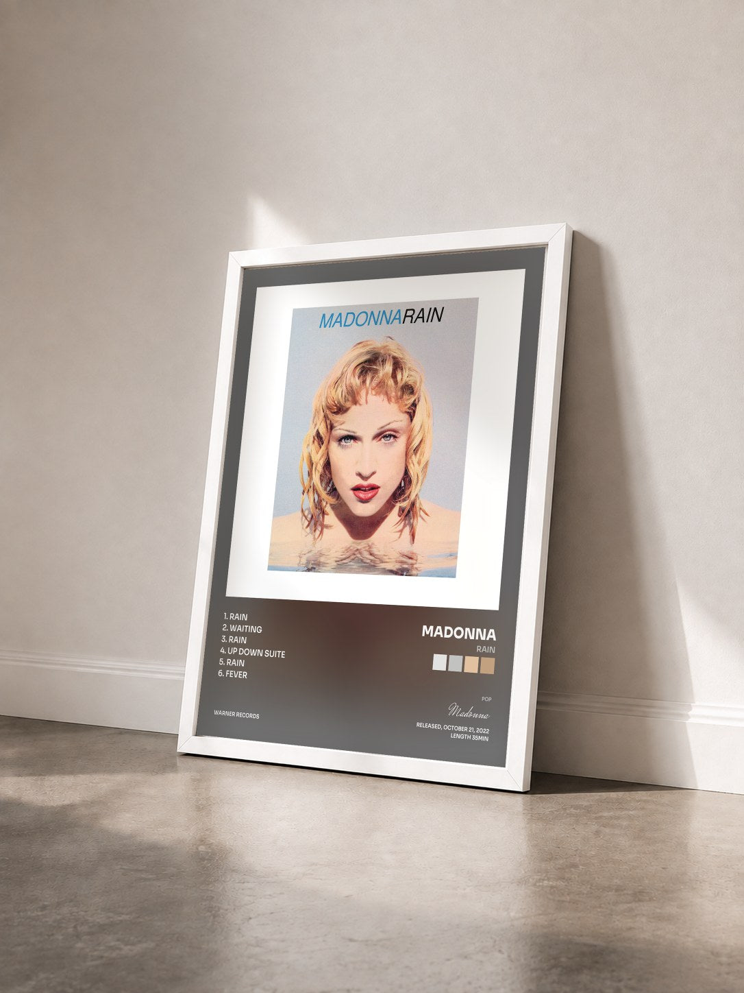 #blanc Tableau de l'album Rain de Madonna vu de trois quarts, cadre blanc