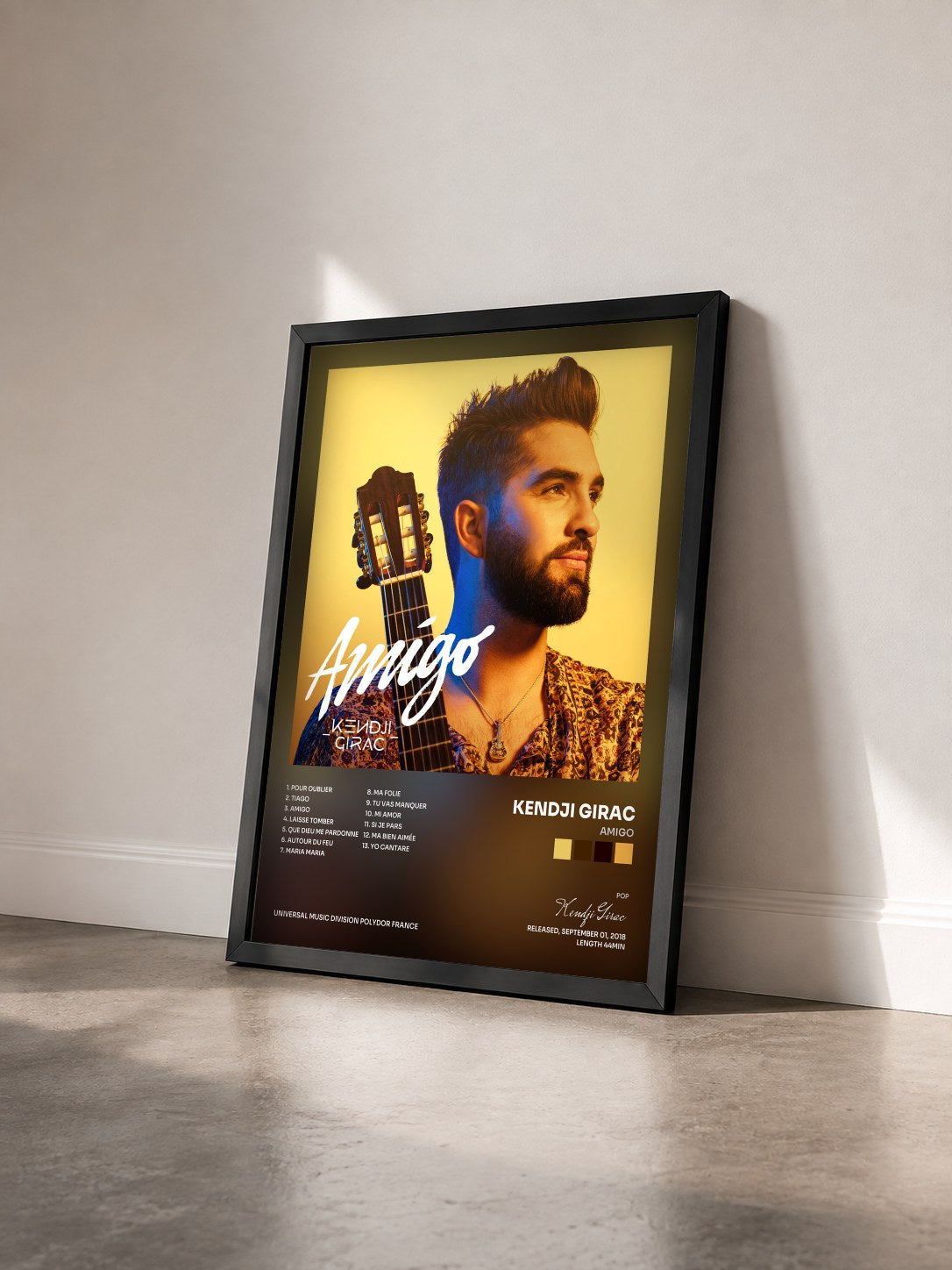 #noir Amigo by Kendji Girac as a framed art print seen at an angle, black frame