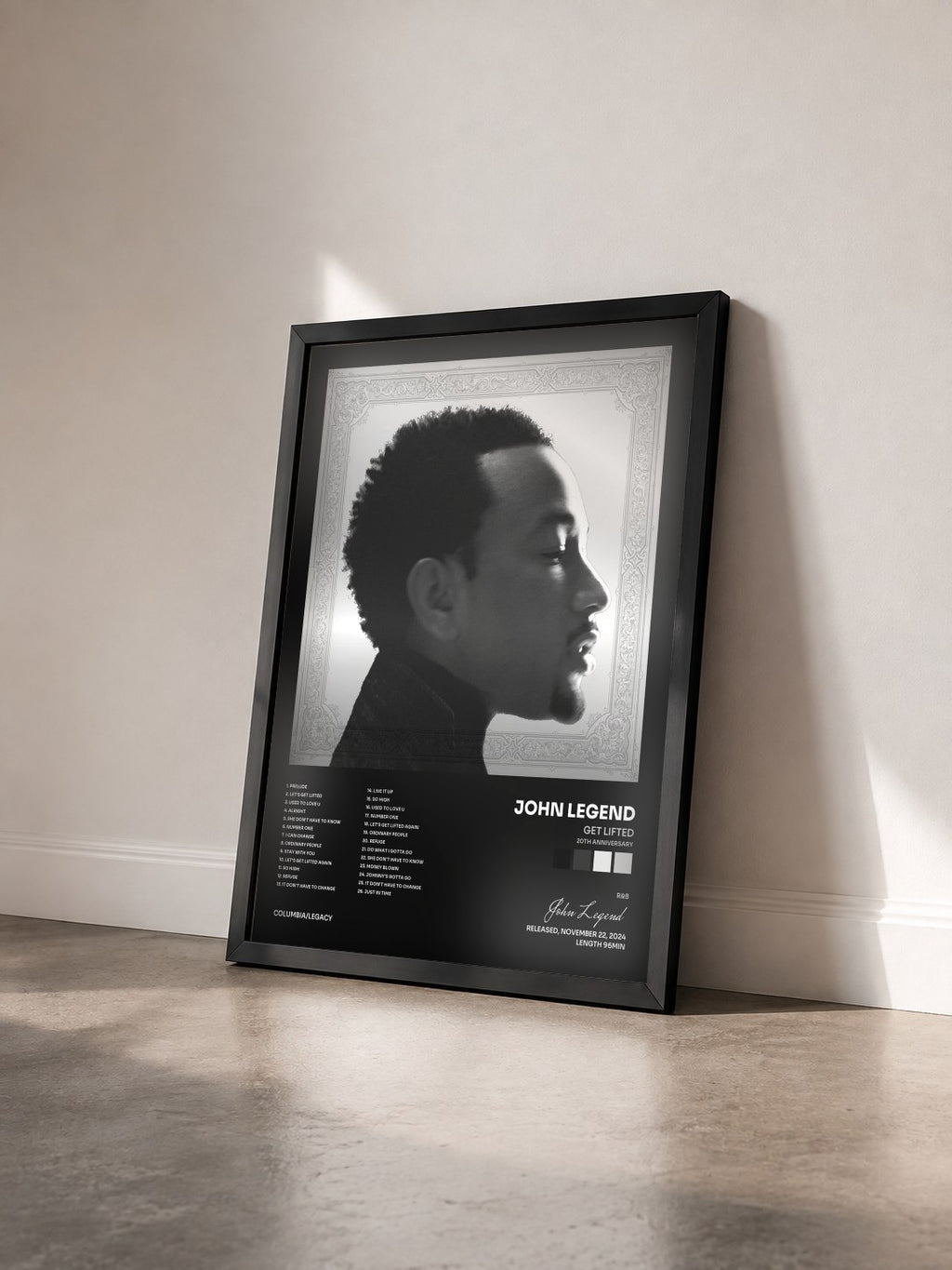#noir Get Lifted (20th Anniversary) von John Legend als gerahmter Kunstdruck von schräg gesehen, schwarzer Rahmen