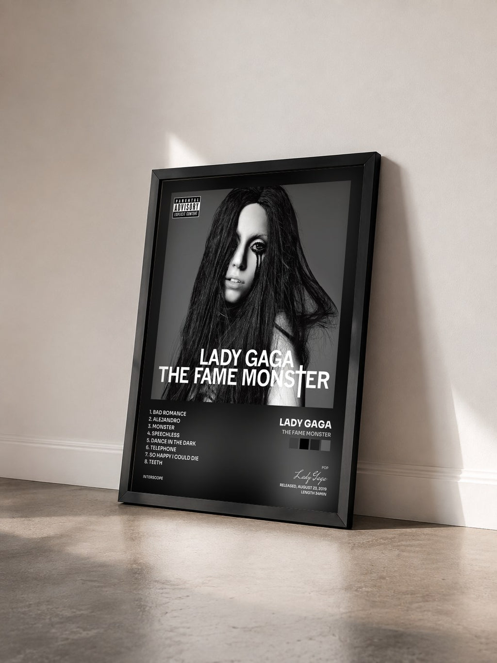 #noir Tableau de l'album The Fame Monster de Lady Gaga vu de trois quarts, cadre noir