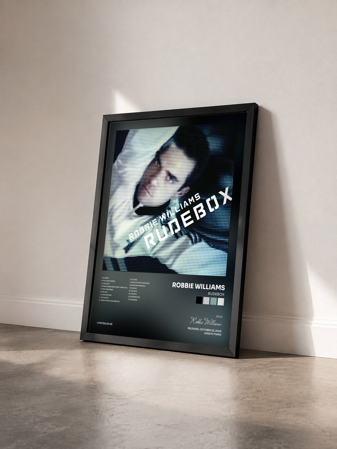 #noir Tableau de l'album Rudebox de Robbie Williams vu de trois quarts, cadre noir