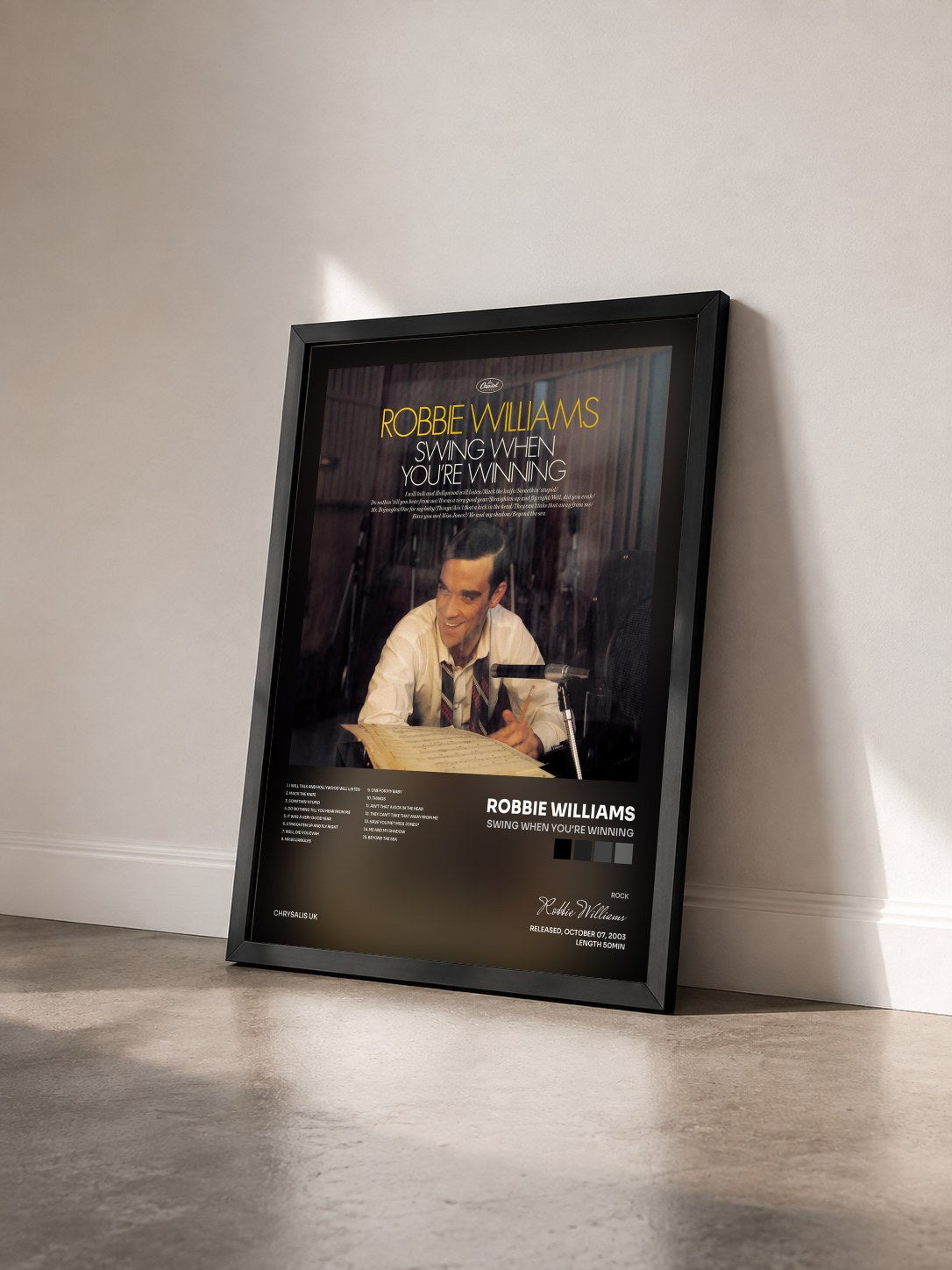 #noir Swing When You're Winning by Robbie Williams as a framed art print seen at an angle, black frame