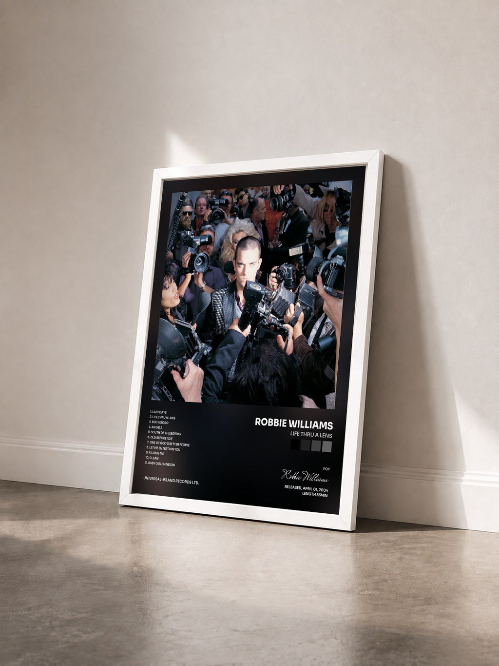 #blanc Life Thru A Lens by Robbie Williams as a framed art print seen at an angle, white frame