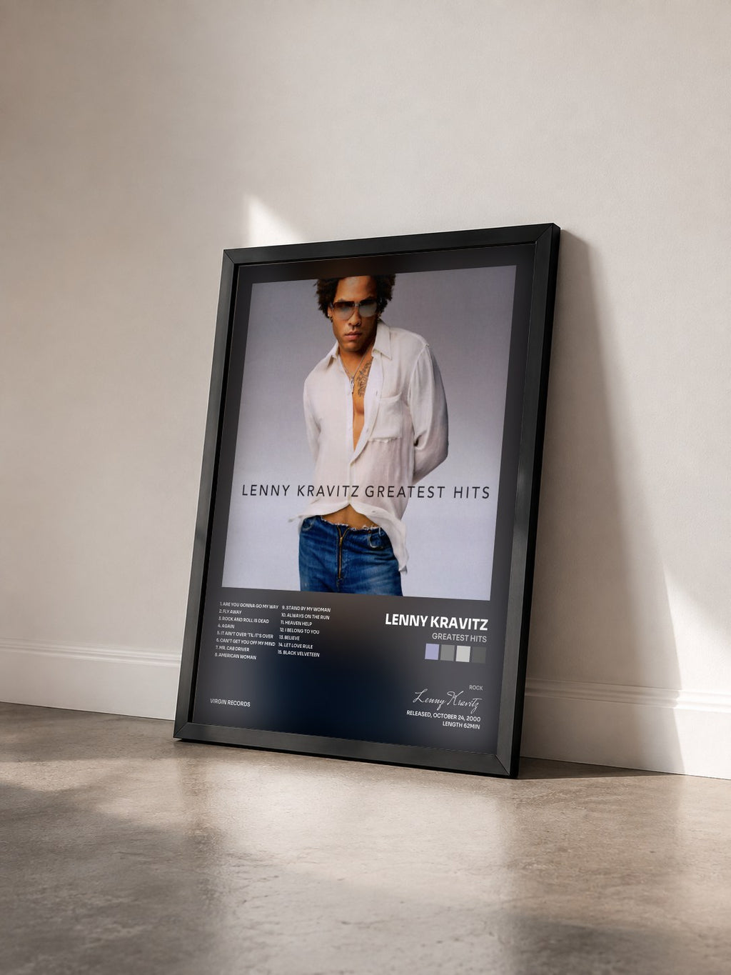 #noir Tableau de l'album Greatest Hits de Lenny Kravitz vu de trois quarts, cadre noir