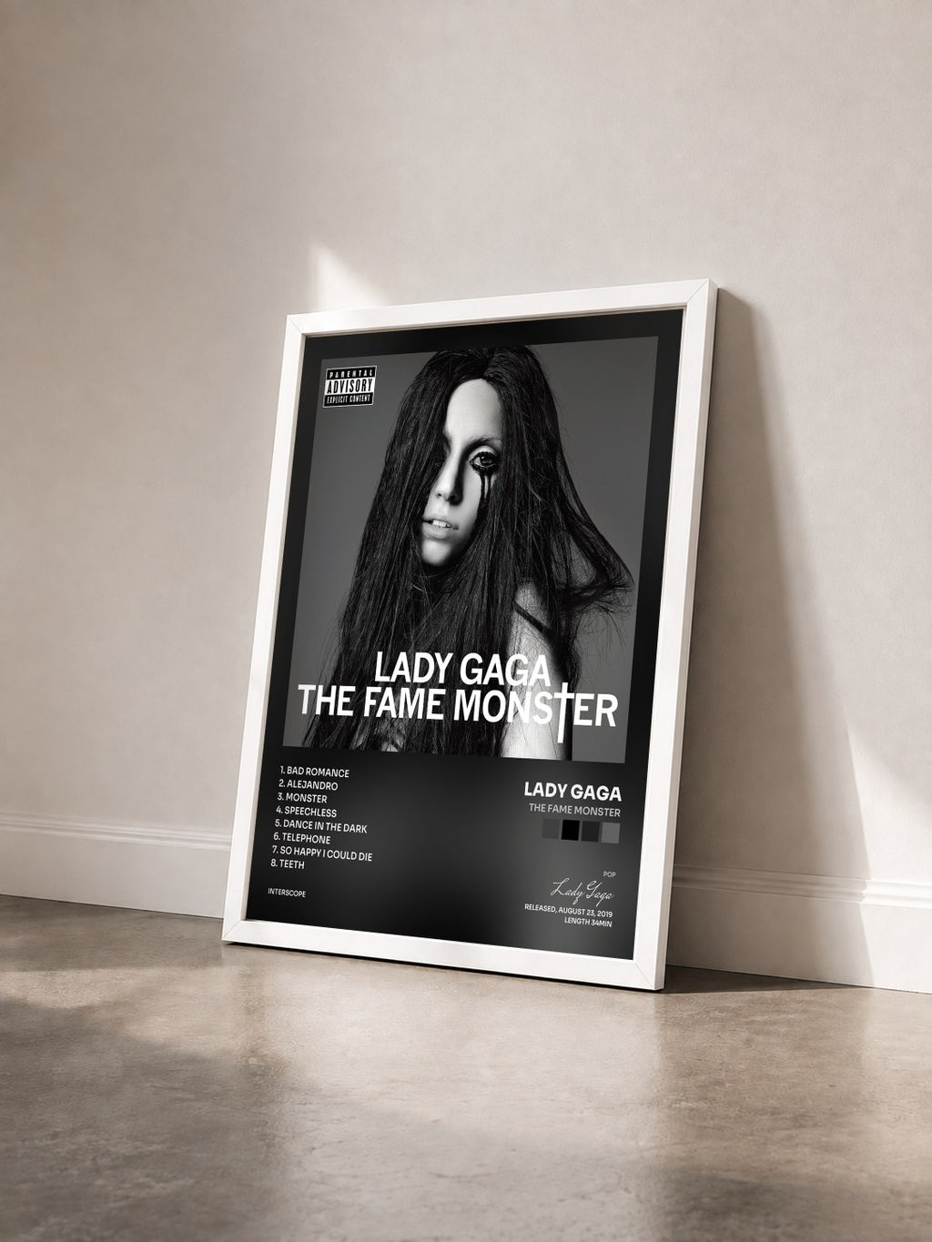 #blanc Tableau de l'album The Fame Monster de Lady Gaga vu de trois quarts, cadre blanc