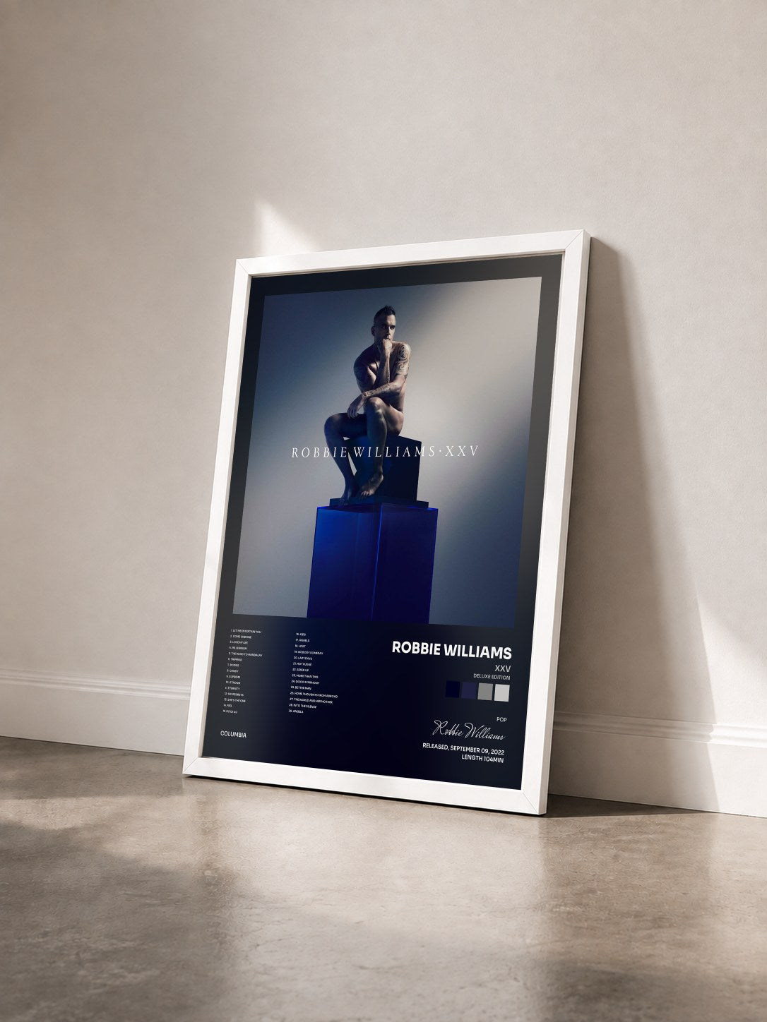 #blanc Tableau de l'album XXV (Deluxe Edition) de Robbie Williams vu de trois quarts, cadre blanc